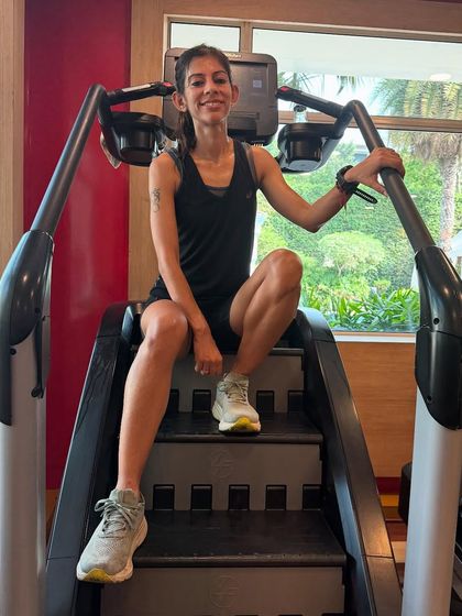 Sitting on the StairMaster after a workout. One sport can change everything. I found my strength through running and lifting, and I want to help others find theirs.