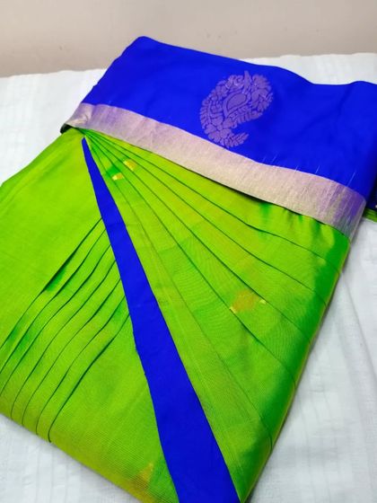 A bright lime green and blue saree, pleated and ready to go. Drape your sarees like a pro in less than five minutes.