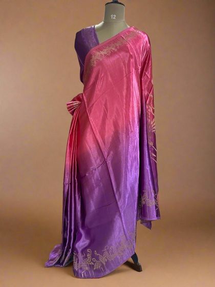 A beautiful shaded satin crepe saree with a flamingo border, transitioning from pink to purple.