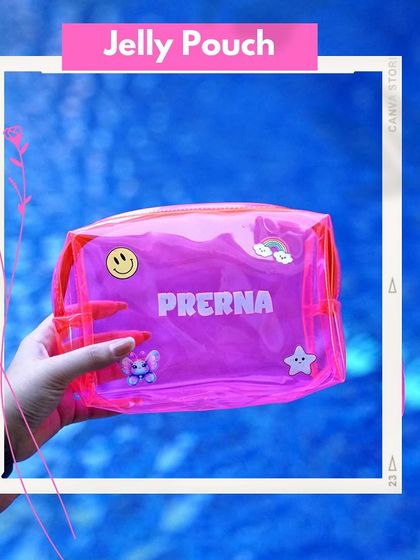 A hand holding a personalized neon pink jelly pouch against a water background. Customized with a name and cute patches, it's a perfect summer accessory or party favor.