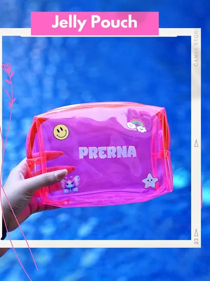 A hand holding a personalized neon pink jelly pouch against a water background. Customized with a name and cute patches, it's a perfect summer accessory or party favor.