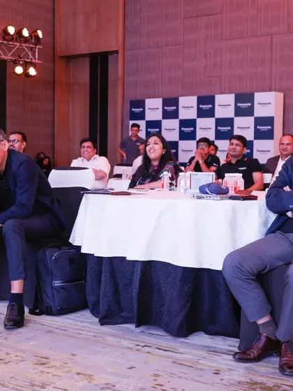 The audience's reaction is everything. Here, guests at the Panasonic event are captivated by the performance.