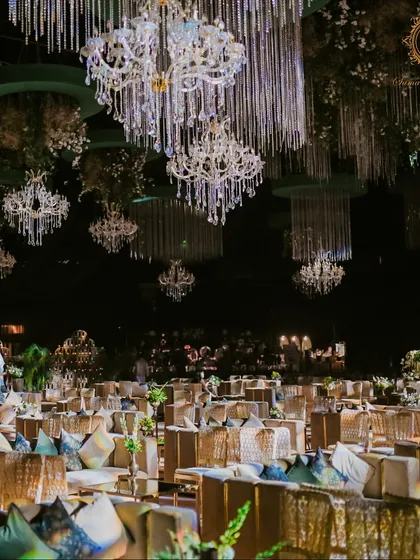 A wide shot of the hall, showcasing the rows of comfortable, stylish lounge seating and the forest of chandeliers that created a magical, starlit effect overhead.