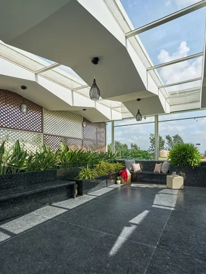 In the 'Wilasa' villa, I designed this terrace as a tranquil escape within an urban setting. The glass roof and abundant planters blur the line between inside and out, offering a space for relaxation that is filled with natural light and greenery.