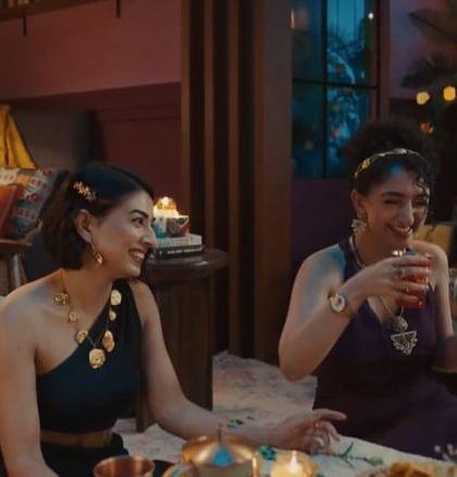 An evening scene from the Chumbak film, where I styled the women in elegant, jewel-toned dresses and statement gold jewelry for a sophisticated party look.