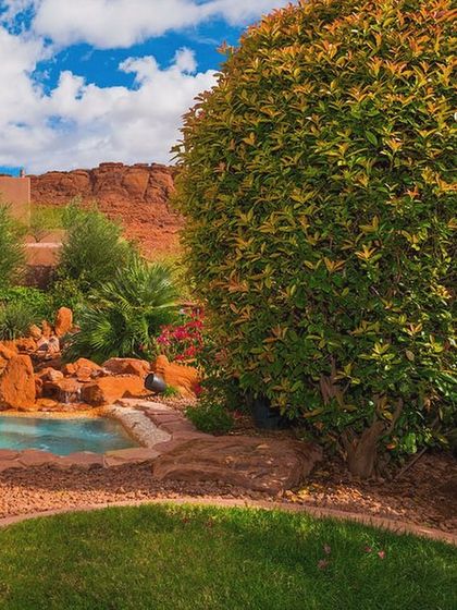 Can you spot the speaker? Our outdoor audio solutions are designed to blend into your landscape. This satellite speaker is tucked away among the foliage, providing rich sound for the pool and garden area without disturbing the natural beauty.