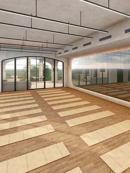 I designed the Yoga Hall at Ignite + Aliign Studio in Bengaluru as a tranquil retreat for mindfulness and movement. The warm wooden flooring, minimalist lighting, and arched glass doors connect the interior to the outdoors, fostering a sense of calm and focus.