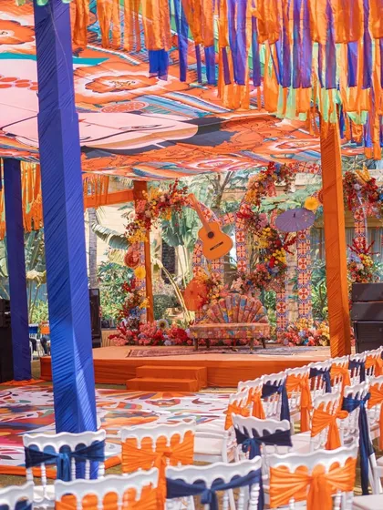 A wide view of the Mexican-themed Mehendi setup, showing the vibrant drapes, seating, and stage.