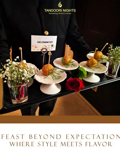A feast beyond expectations is where style meets flavor. Our servers present beautifully arranged Chilli Edamame Cups on individual pedestals, complete with floral accents.