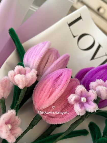 A detailed close-up of the pipe cleaner tulips. The unique texture of the material gives these flowers a soft and dreamy appearance.
