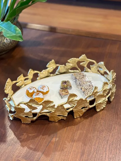 Our gold-leafed ginkgo platter, styled with festive sweets. This piece is designed to blend functionality with timeless beauty, making every moment of hosting feel effortless and elegant.
