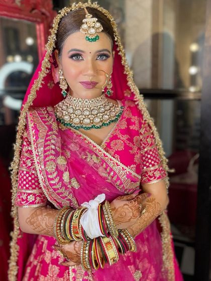 Another shot of this stunner in pink. Her smile says it all. The makeup was designed to be long-lasting and picture-perfect.