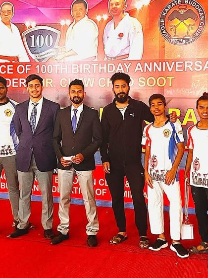 Posing with the team and officials. These events are a celebration of the discipline and hard work that unites us all.