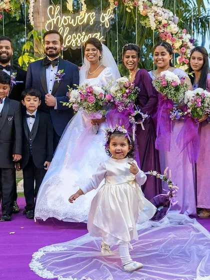 The flower girl steals the show. Capturing these unscripted, real moments is what makes wedding photojournalism so special.