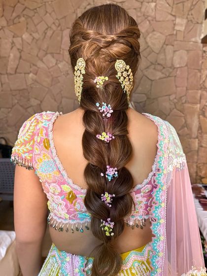 A clear, straight-on back view of the bubble plait, showcasing its structure and the playful arrangement of flowers.
