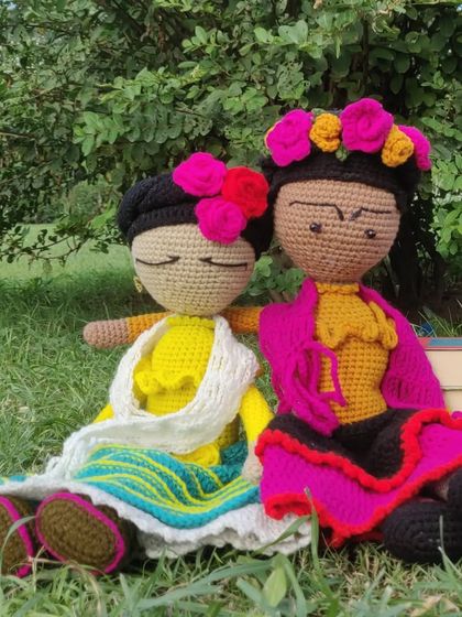Two Frida dolls enjoying a quiet moment in the garden. They make beautiful decorative pieces that celebrate art, culture, and female strength.