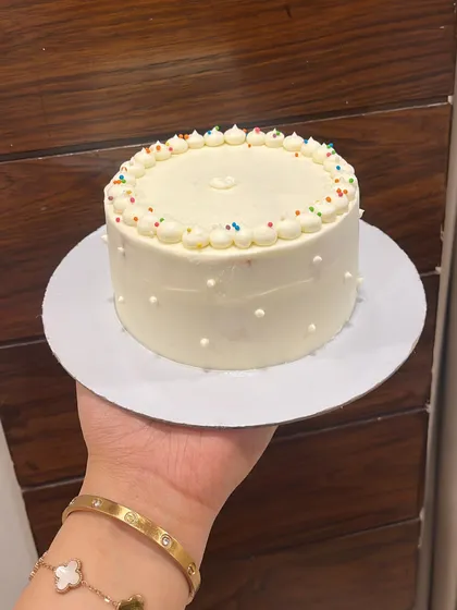 Sometimes, less is more. A minimalist white bento cake with a sprinkle border, proving that simple can be beautiful.