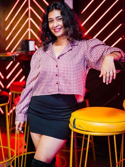 A guest posing at the bar.