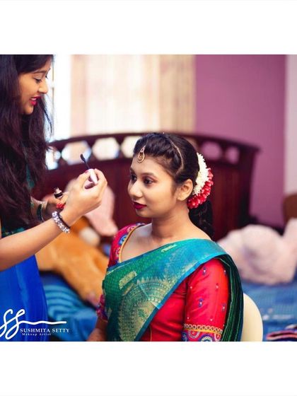 A behind the scenes photo of me applying the finishing touches. I always make sure every detail, from the eyeliner to the lip color, is absolutely perfect.