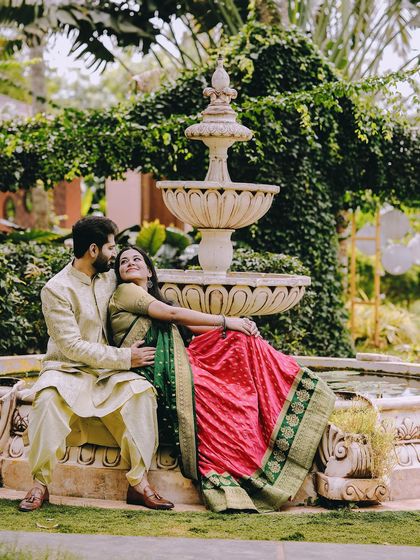 A tender moment by the garden fountain, perfect for a traditional and romantic photoshoot.
