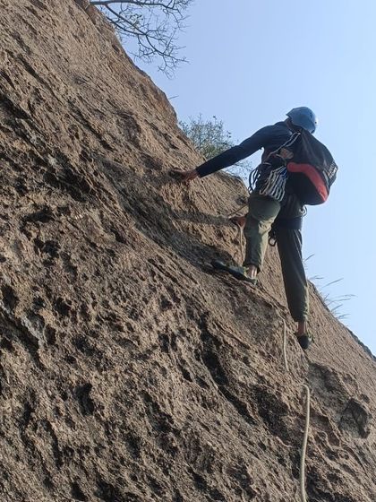 A climber navigates a technical section of the 'Naatu Naatu' route. Multi pitch climbing requires endurance, skill, and a cool head.