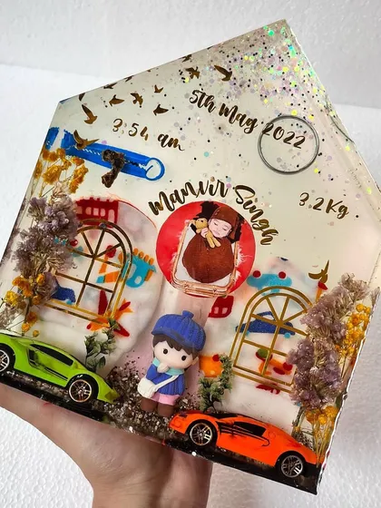 A new shape in our collection. This house-shaped block art is a wonderful way to preserve and display your baby's first keepsakes.