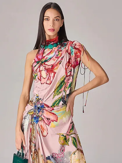 A close-up of this artistic printed dress, highlighting the beautiful draping at the hip and the vibrant, painterly quality of the floral design.