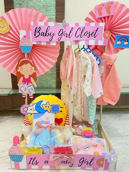 This "Baby Girl Closet" hamper is all about sweet details. We've included cute character cutouts, cupcakes, and rainbows to make it extra special.