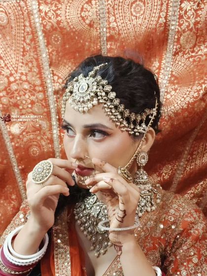 This bride exudes main character energy. The makeup is bold and confident, designed for the modern bride who wants to make a statement.