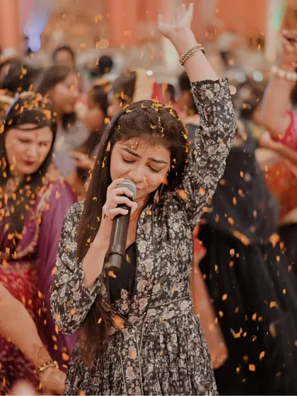 A powerful shot from the Raipur event, capturing the energy of the performance and the joy of the audience.