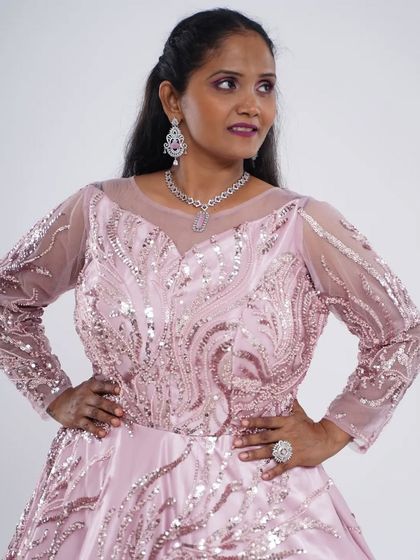 A full-length look at the pink sequence motiwork ball gown. It’s a timeless design that brings a touch of royalty to any event.