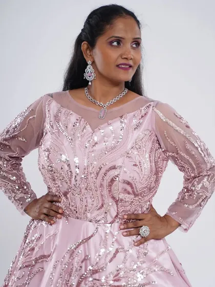 A full-length look at the pink sequence motiwork ball gown. It’s a timeless design that brings a touch of royalty to any event.