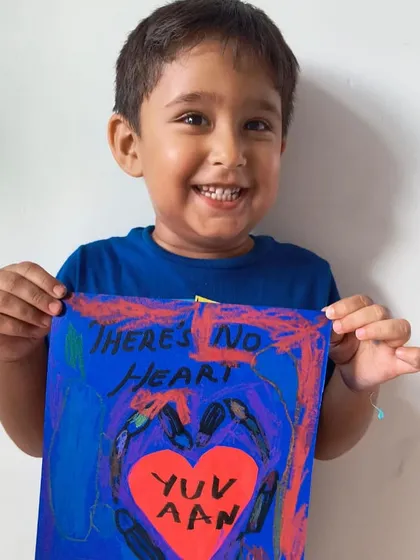 Another student's take on the "Heart in Art" theme, using handprints and a vibrant color palette.