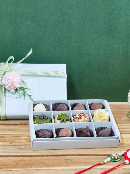 Another look at our 12-piece exotic dry fruit mithai box, elegantly packaged and ready to be gifted for Raksha Bandhan. It's a modern take on traditional sweets.