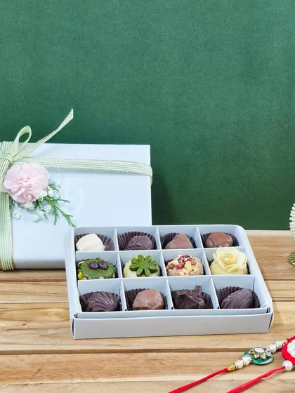 A closer look at the mixed 12-piece Rakhi box, showing the different shapes and textures of my handmade chocolates and mithai.