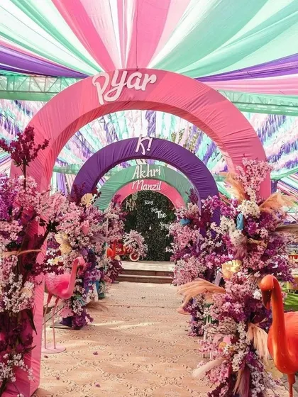 Make a grand statement from the very first step. This vibrant, multi-colored arched entryway was designed for a fun-filled Haldi ceremony, setting a joyful and festive tone for the event.