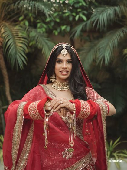 A happy, confident bride. The matte brown makeup look is versatile and suits all skin tones, making it a popular request.