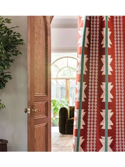 A single fabric can define a room. This Chimayo fabric, with its bold stripes and intricate couched embroidery, offers a modern twist on traditional design. I use such statement textiles for drapes or upholstery to add a vibrant pop of colour and personality.