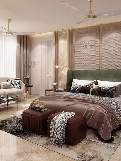 A bedroom that combines warm earth tones with a touch of green. The gold-accented paneled wall and hanging pendant lights add a layer of luxury, while the large window provides a beautiful view.
