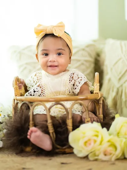 A sweet smile from this six-month-old. The simple, elegant props keep the focus on her adorable expression.