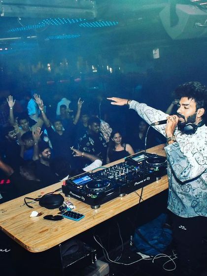 Getting the crowd to put their hands up at Helium Pune. My goal is to make every set an interactive experience.