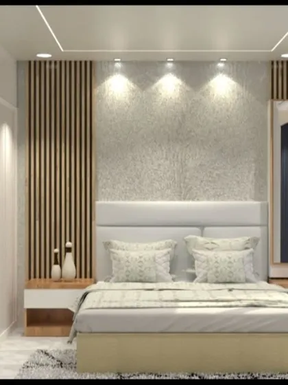 This bedroom design uses a textured grey wall and wood fluting to create a sophisticated feature wall behind the bed.
