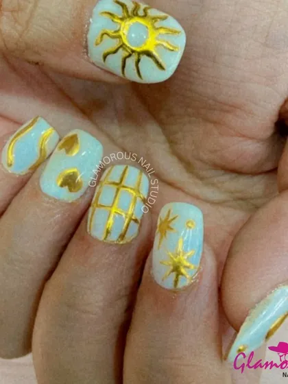 Golden hour, all day long. This celestial-themed set features a sheer, shimmery base with intricate, hand-painted gold designs of the sun, stars, and grids.