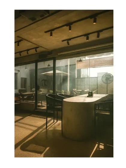 We designed this cafe to have a strong connection between the indoor and outdoor spaces. Large glass panels allow for an abundance of natural light and a view of the patio, making the interior feel open and airy.