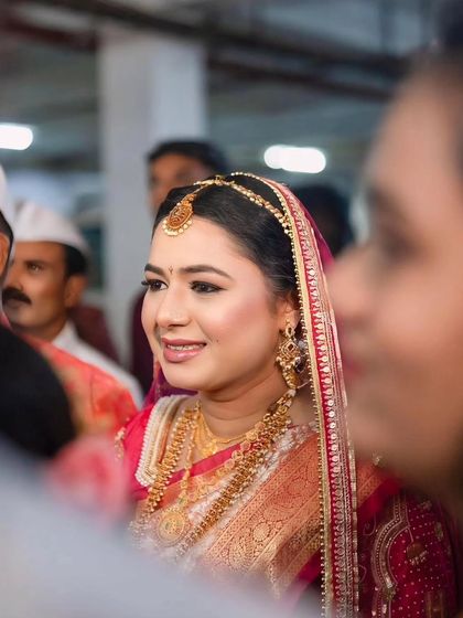 A candid portrait of the bride, her face glowing with happiness as she participates in the wedding rituals. My goal is to capture your natural beauty and emotion throughout the day.