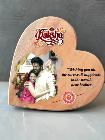 This heart-shaped wooden frame is a perfect Rakhi gift. It features a custom photo with a brush effect and a sweet message for your brother.