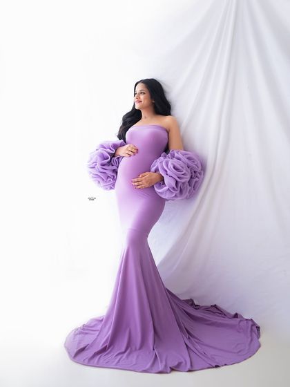 A serene solo portrait in our popular lavender Rosa gown. The mermaid-style fit and flowing train create such a graceful silhouette.