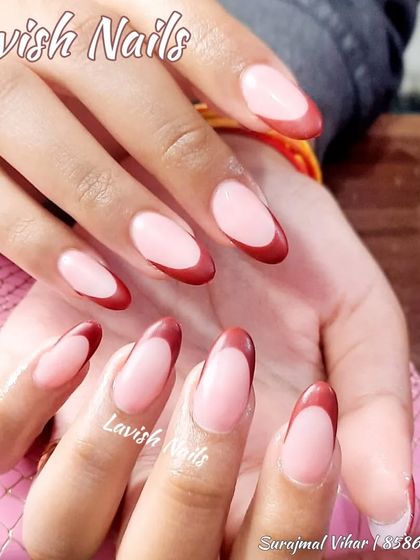 A close-up of the deep red French manicure, showcasing the clean smile line and rich color.