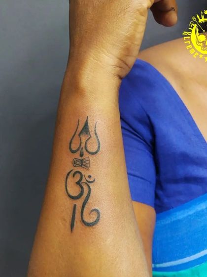 A minimalist yet powerful Om Trishul tattoo. Even smaller designs can carry great significance, and I make sure the lines are sharp and precise.