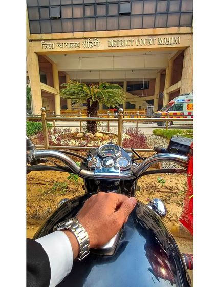 Arriving at Rohini District Court. Whether I come on a bike or in a car, I bring the same fire and determination to every case.